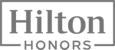 The image shows the Hilton Honors logo in a rectangular frame with "Hilton" on top and "Honors" below.