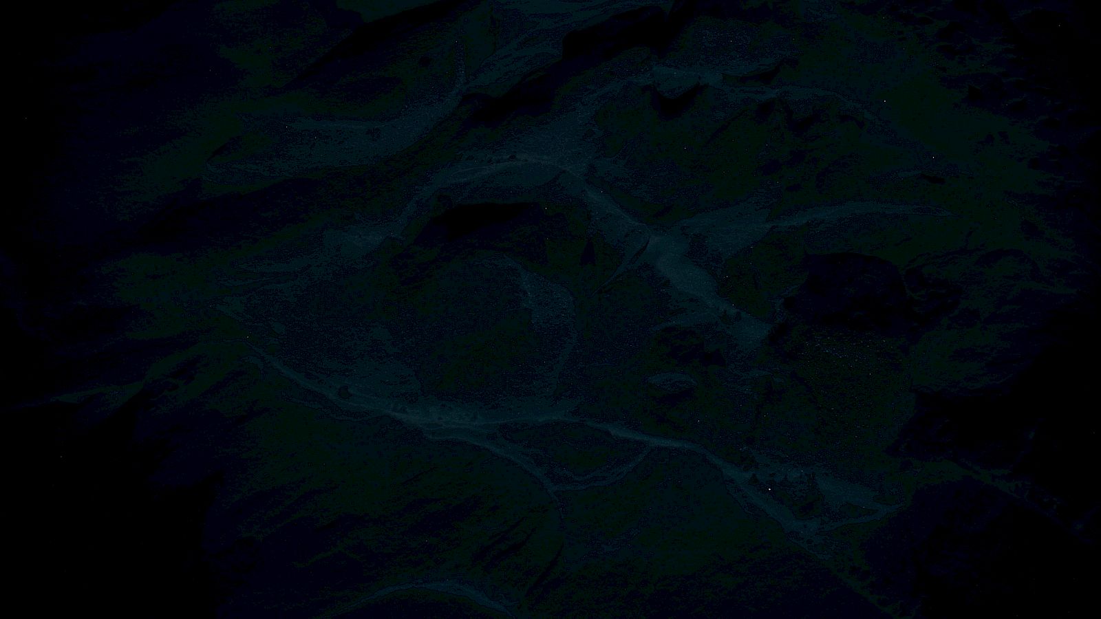 The image is very dark and indistinct, making it difficult to identify any specific objects or scenery.